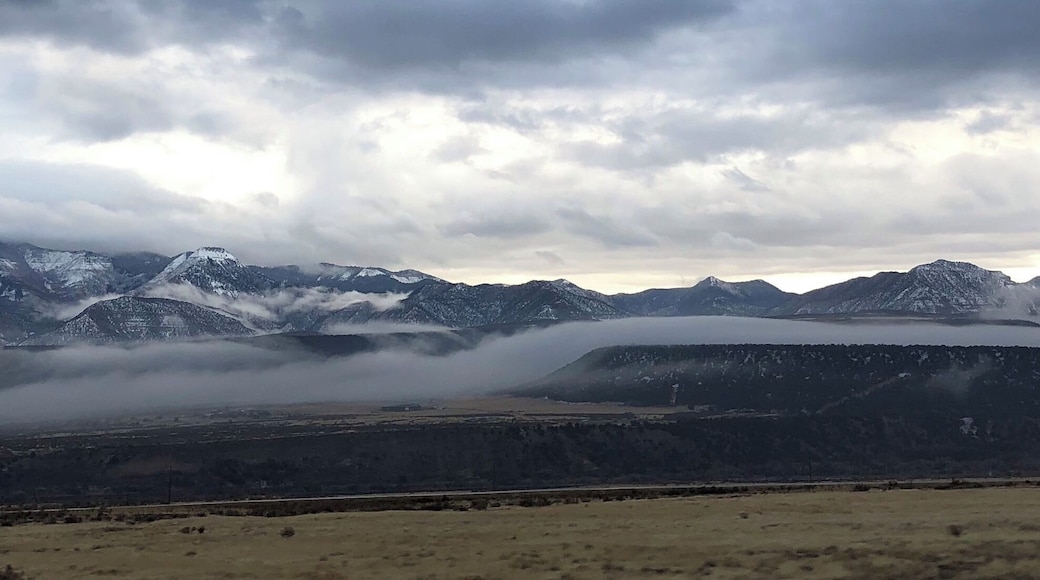Low hanging clouds and the sun peeking through, this is awesome scenery just made better.