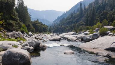 The beautiful Feather River flows through a scenic canyon in Northern California' Sierra Nevada Mountains. This beautiful flow of water is the principal tributary to the Sacramento River.