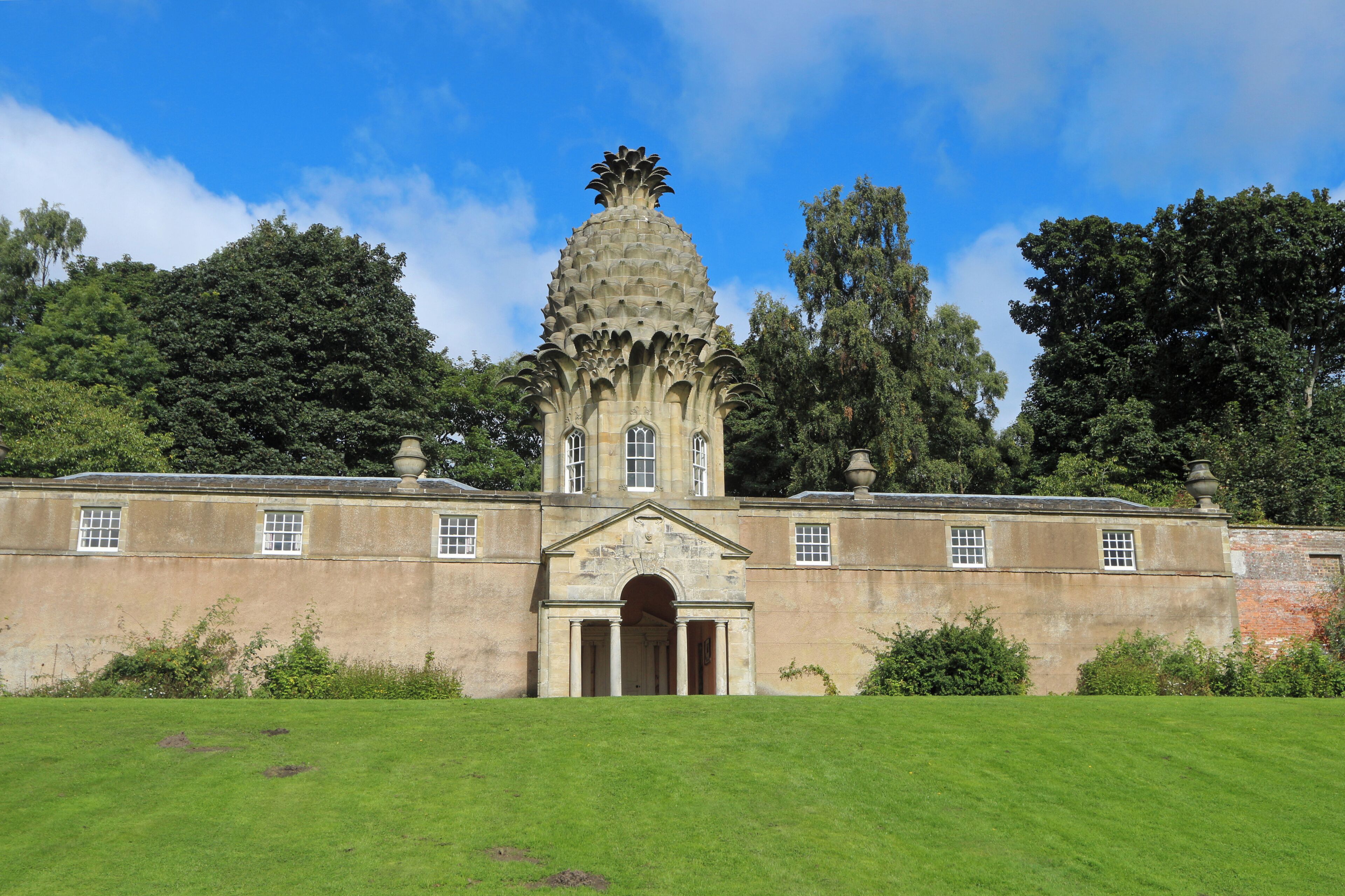 A large building with a pineapple-shaped tower and a symmetrical facade.