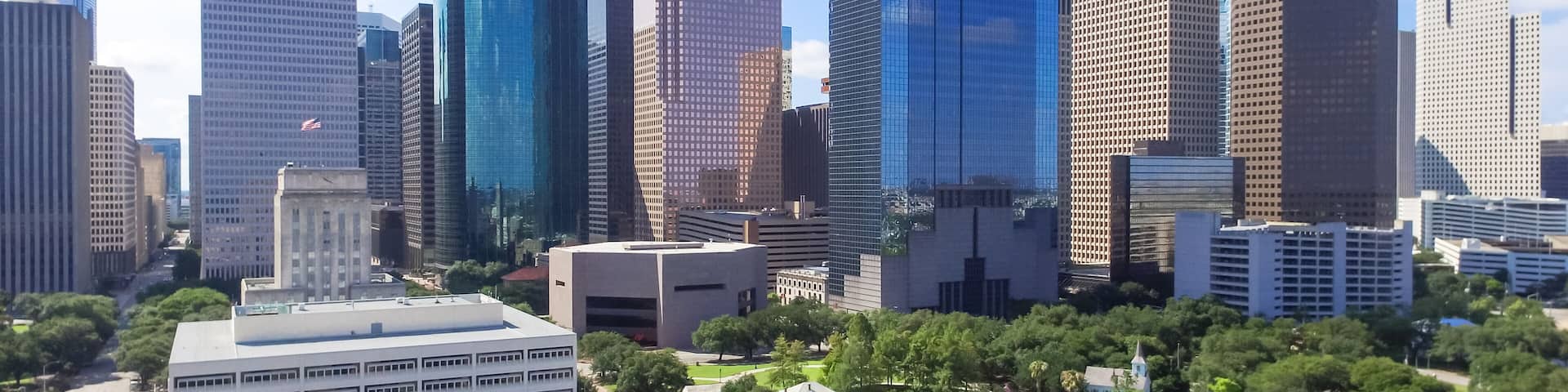 Aerial view Houston downtown and Gulf Freeway (highway I45). Daytime cityscape with cloud blue sky.