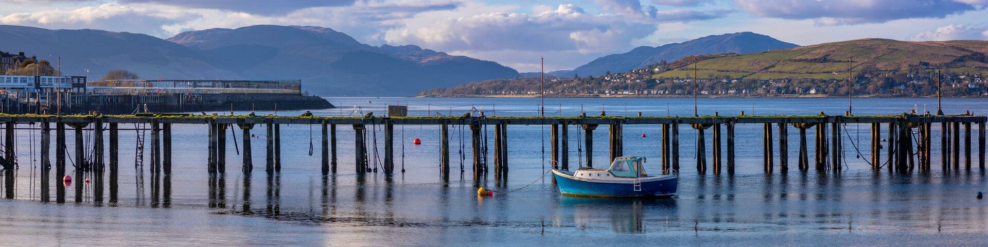 Abandoned Admiralty Pier and boat, Firth of Clyde, Gourock, Inverclyde, Scotland, United Kingdom, Europe