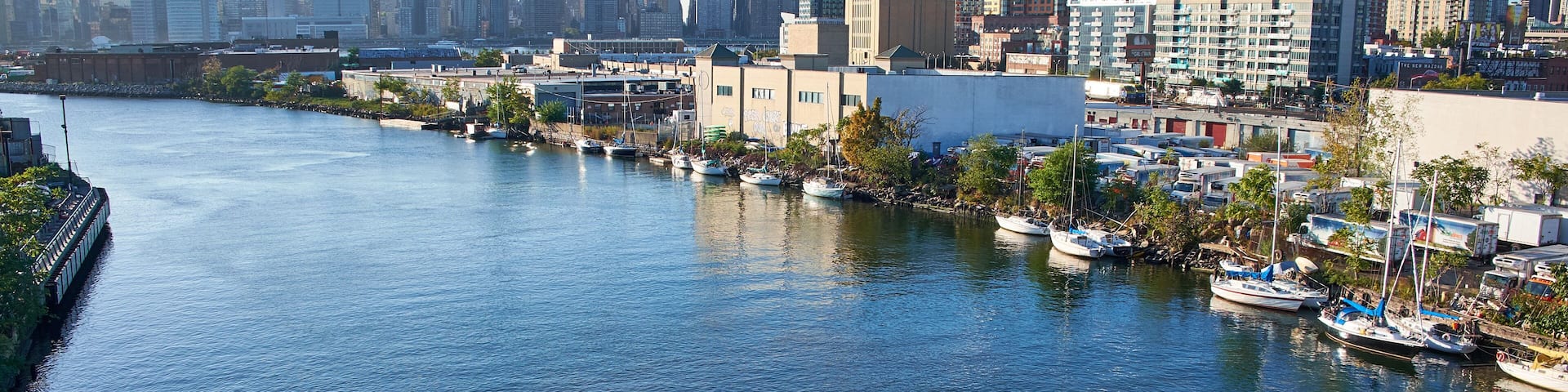 NEW YORK CITY - OCTOBER 05, 2016: Looking at Manhattan skyline from Pulaski Bridge in Queens, boats are moored along the river