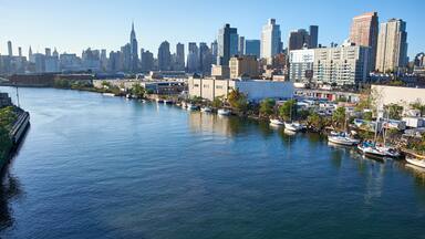 NEW YORK CITY - OCTOBER 05, 2016: Looking at Manhattan skyline from Pulaski Bridge in Queens, boats are moored along the river