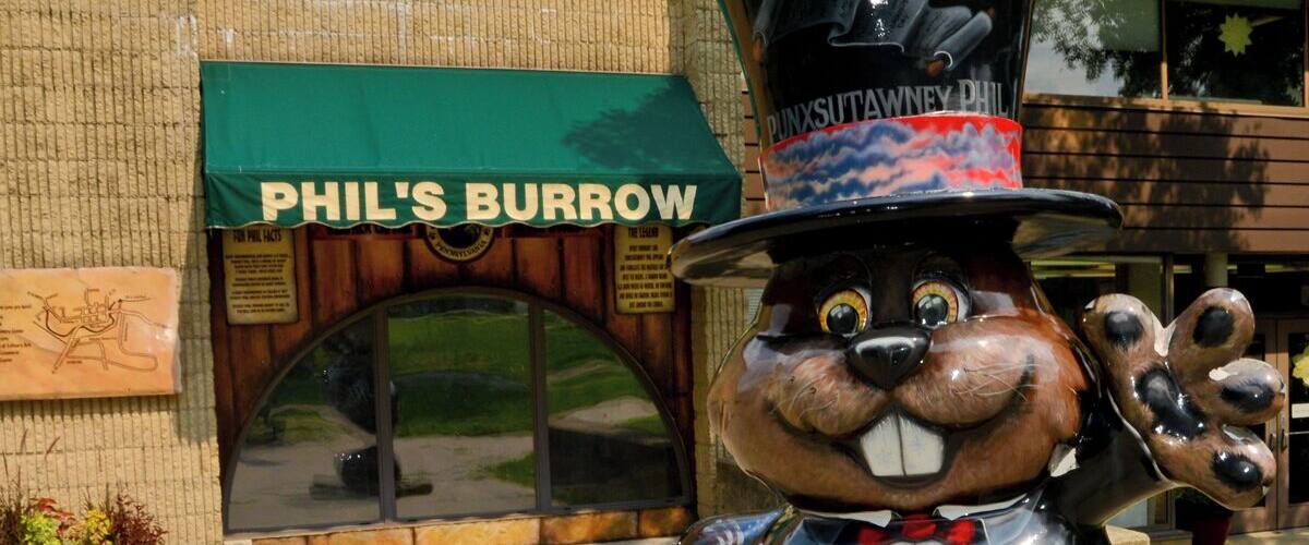 Mini Takes the States 2014 Road Rally Buffalo to Bethlehem Leg:
"Phantastic Phils!" Public Art Project is brought to you by The Punxsutawney Groundhog Club and NW PA's Great Outdoors Visitors Bureau. You will not be able to avoid these when visiting the area so... enjoy.
There are 32 big ole' fiberglass groundhogs on the streets throughout the community.
This one is "Phillage" Artist - Kelly Porada. He is standing in front of his burrow, which is located in Barclay Square, attached to the library.
Viewing windows let visitors see Phil all year round.
#minitakesthestates