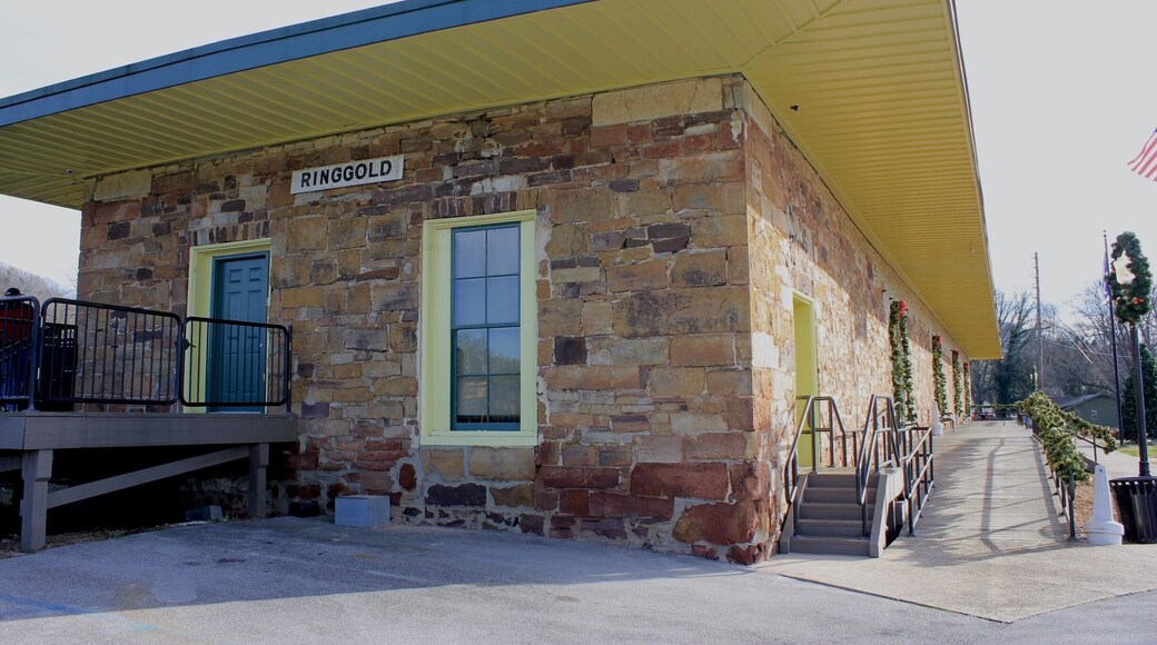 Constructed in 1849, the Western & Atlantic depot at Ringgold is one of the state's oldest rail stations. In 1862 Andrews' Raiders came through town in the locomotive General followed closely by their pursuers in the Texas. Andrews' unsuccessful attempt to disrupt Confederate rail operations came to an end two miles to the north of here.
After sustaining damage from Union artillery during the November 27, 1863 Battle of Ringgold, the 14-inch dark sandstone walls of the building were repaired with light-colored limestone blocks, giving the depot a distinct two-toned appearance.