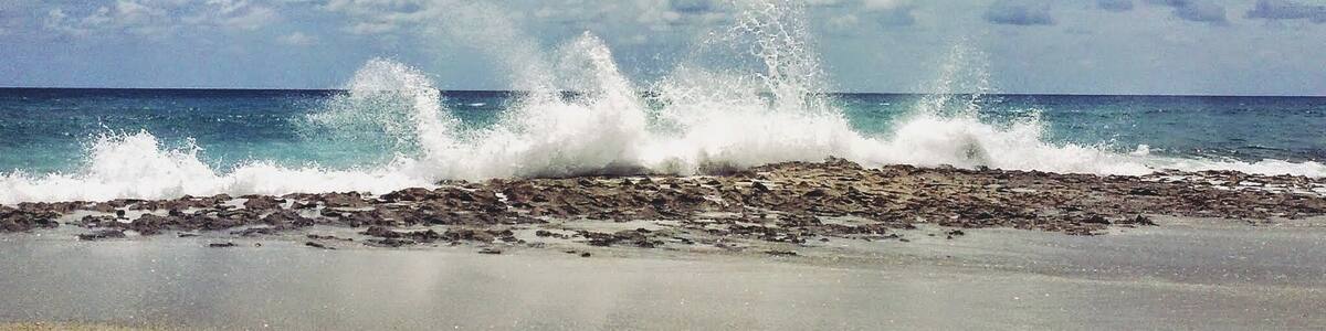 The shoreline at Riviera Beach in Florida is dotted with patches of Anastasia Limestone which causes the water to shoot up like a geyser when the waves crash against them. #Wanderlust #Explore #Travel #Beach #Florida