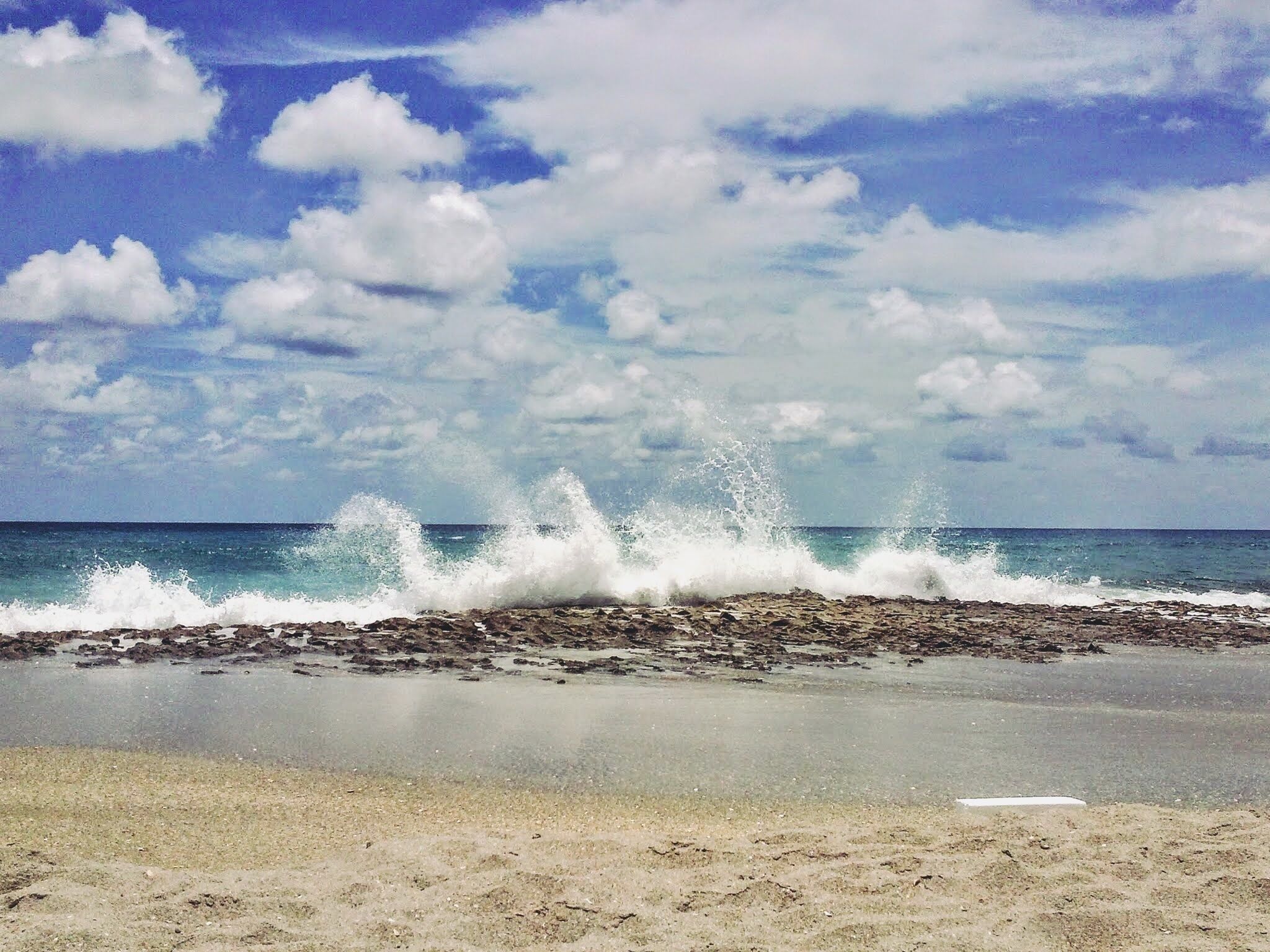 The shoreline at Riviera Beach in Florida is dotted with patches of Anastasia Limestone which causes the water to shoot up like a geyser when the waves crash against them. #Wanderlust #Explore #Travel #Beach #Florida 