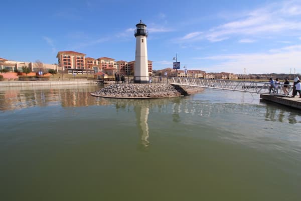 On the pier, facing hotel.