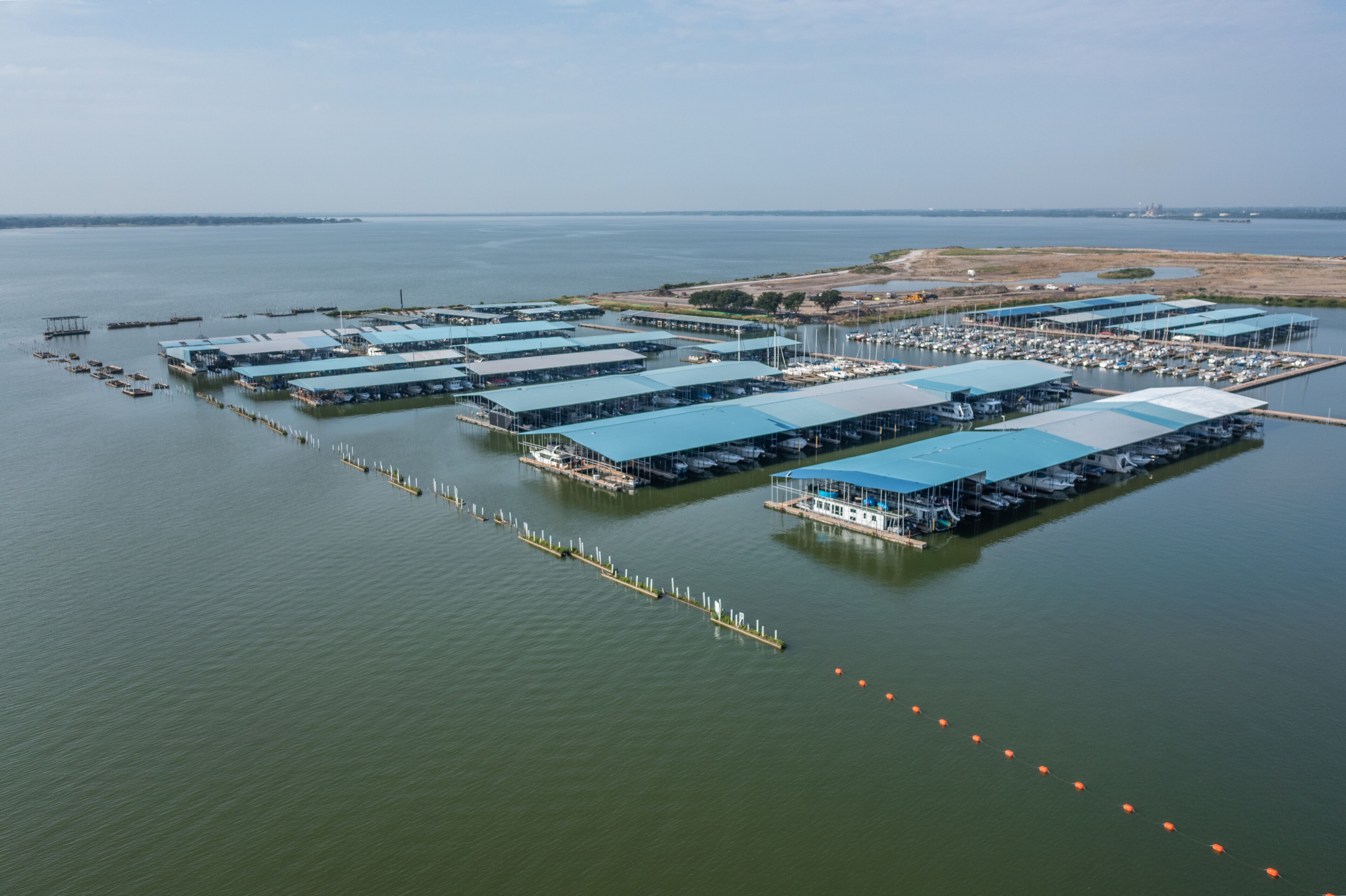 Large Boat Docks and Buildings on Lake in Harbor of Rockwall, Texas