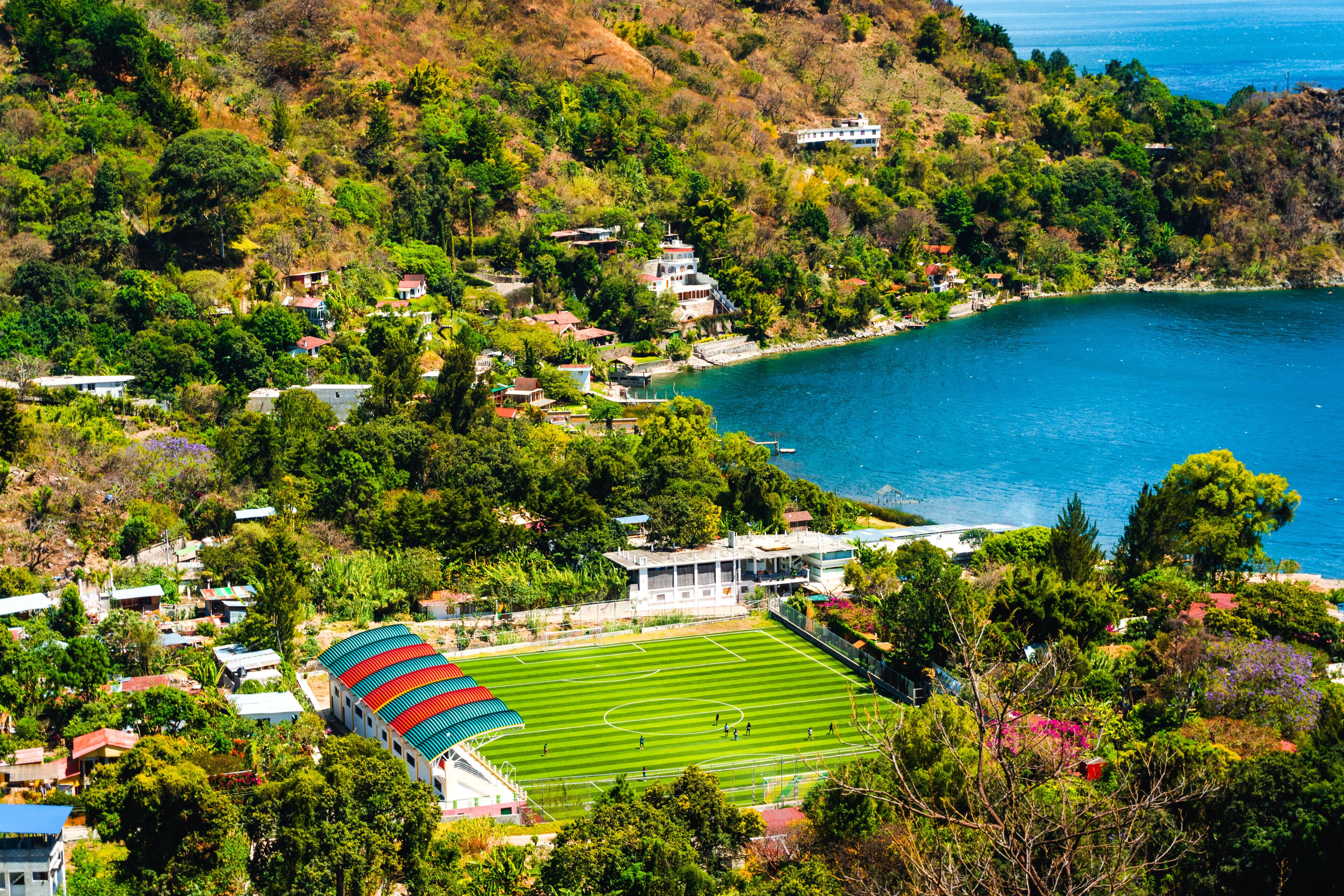 Sports court, village, lake and mountains, San Marcos la Laguna, Guatemala