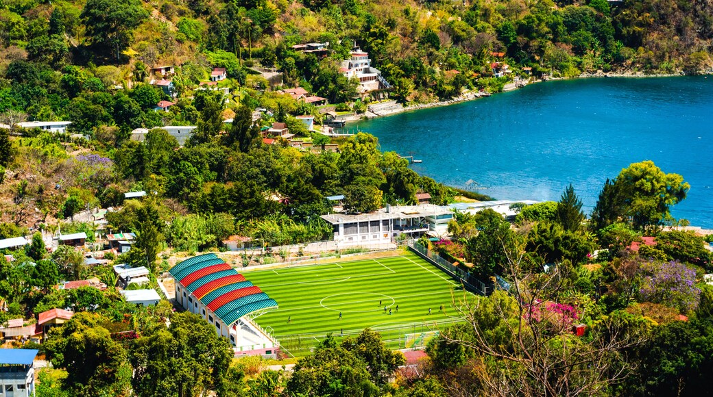 Sports court, village, lake and mountains, San Marcos la Laguna, Guatemala