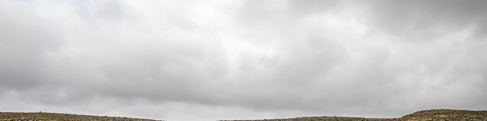 Terrell County, Texas / United States - June 2, 2020: The Amtrak Sunset Limited train travels through the desert near Sanderson, Texas.