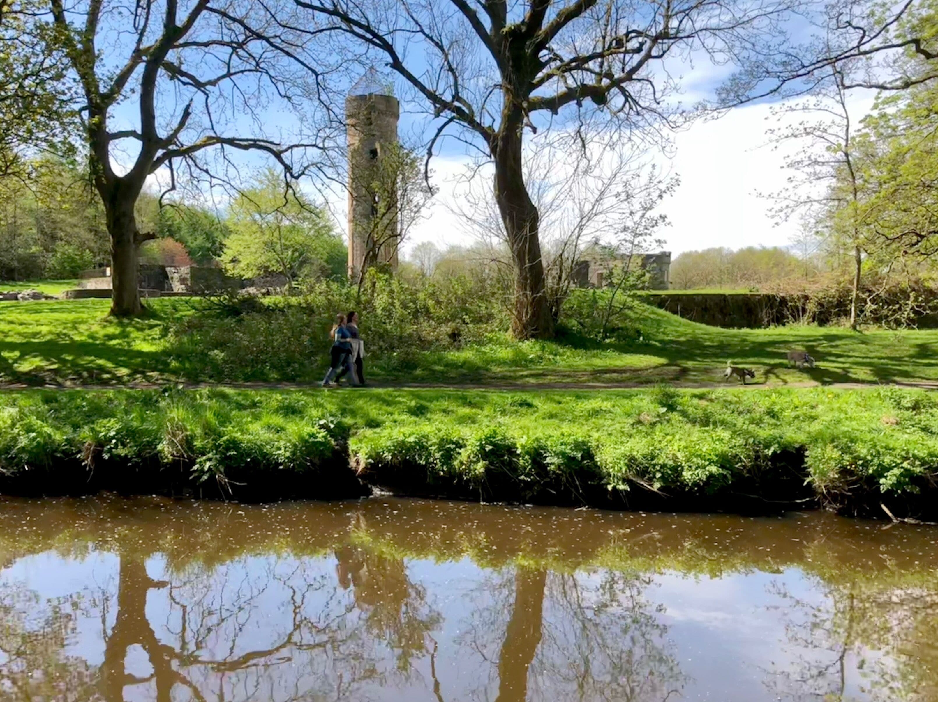 View across the Lugton Water to the ruins of Eglinton Castle in Eglinton Country Park