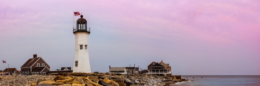 Scituate Lighthouse in Scituate, Massachusetts. Historic Landmark Navigational Facility in America. Panoramic Twilight Seascape with Space for Text and Design.