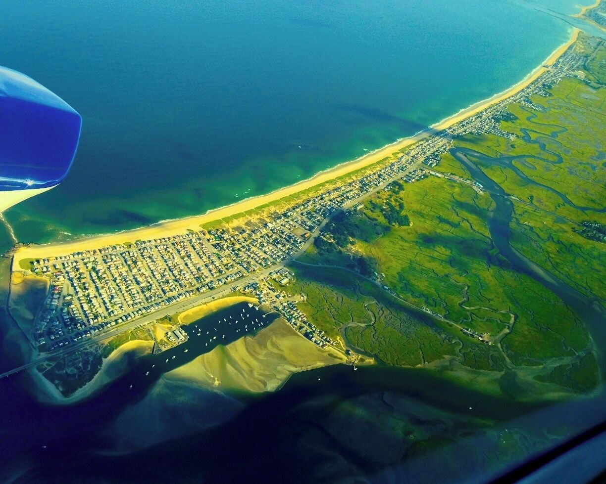 Gre up on this beach every summer,  Markey's and Browns are in the Marsh to the bottom right. Cape Air Flight from Boston to Augusta. Beautiful coastal flight. 

Markey's and Browns are know for their  fried clams, steamers, lobsters and fried haddock. Both places are great, one would think they compete, I worked at Markey's when I was younger, they don't. No one place could handle all the people. The major difference is Markey's serves beer, Browns is BYOB.