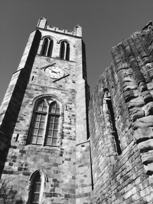 The clock tower looking dark