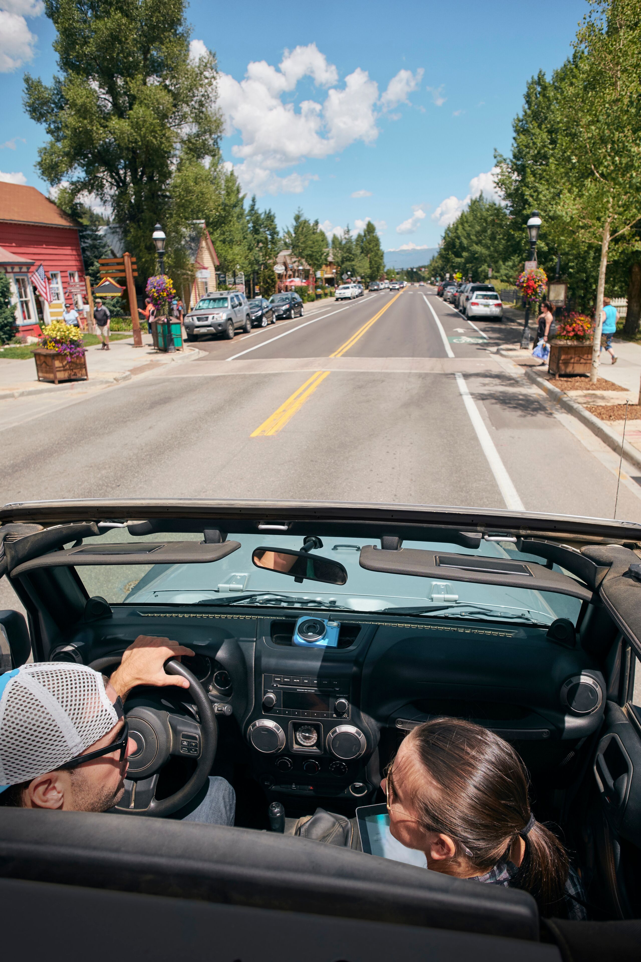 Road trip couple driving through town, Breckenridge, Colorado, USA