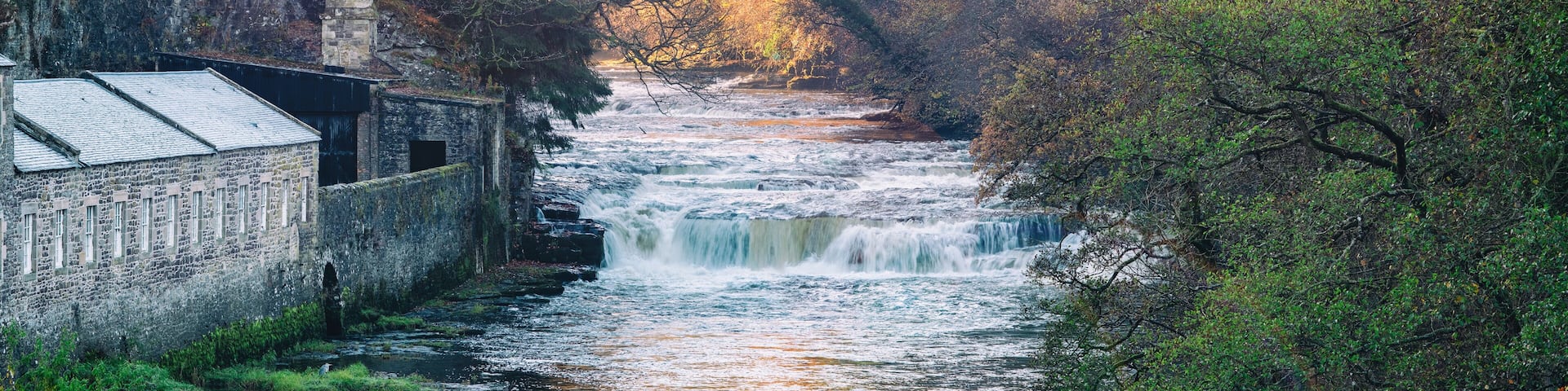 Dundaff Linn, the lowes of the Falls of Clyde as seen from New Lanark at sunrise. Scotland, UK
