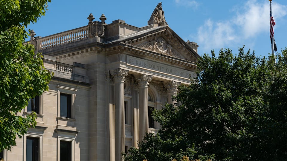 A historic courthouse with classical architecture, columns, and a prominent entrance.