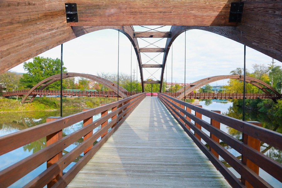 Midland's three-way 'Tridge' on a bright summer day is the symmetrical intersection of three elevated walkways on a recreation trail.