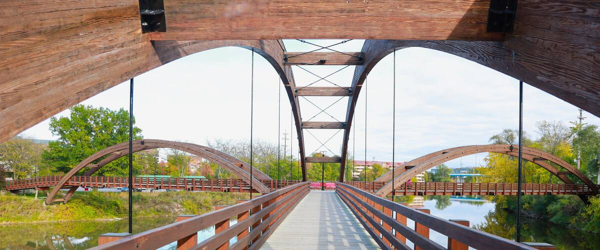 Midland's three-way 'Tridge' on a bright summer day is the symmetrical intersection of three elevated walkways on a recreation trail.