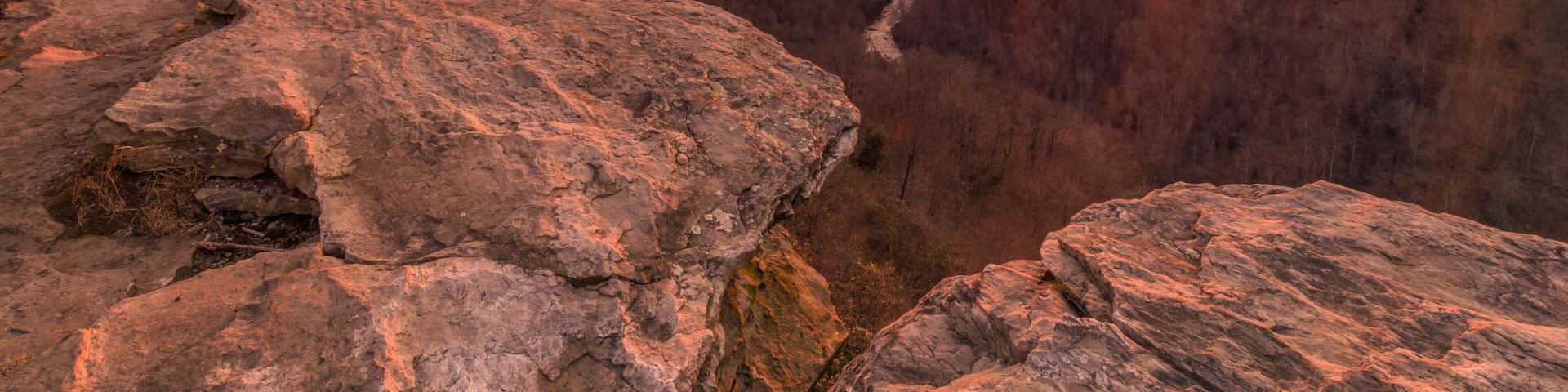 USA, West Virginia, Blackwater Falls State Park. Sunset over rocks and forest.
