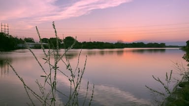 The West Twin river flows through Shoto falls to the west side of the city of Two Rivers and into Lake Michigan. This was taken at dawn as the sun is starting to set on the horizon. Th3 Golden Hour.