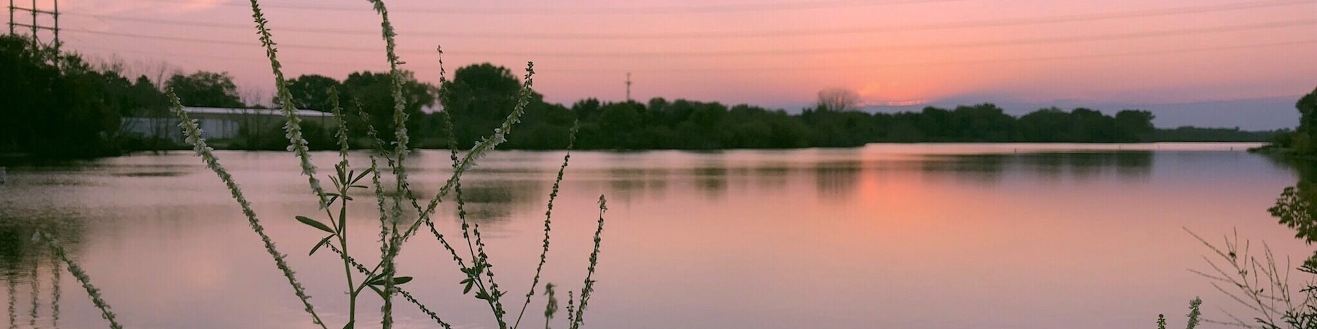 The West Twin river flows through Shoto falls to the west side of the city of Two Rivers and into Lake Michigan. This was taken at dawn as the sun is starting to set on the horizon. Th3 Golden Hour.