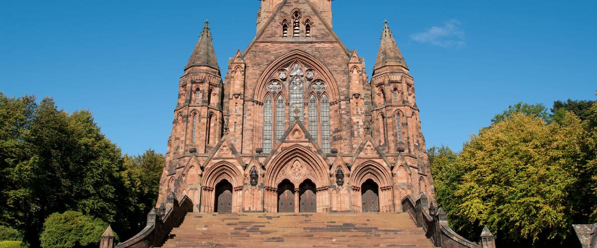 A large Gothic-style church with a prominent central tower and multiple smaller towers.