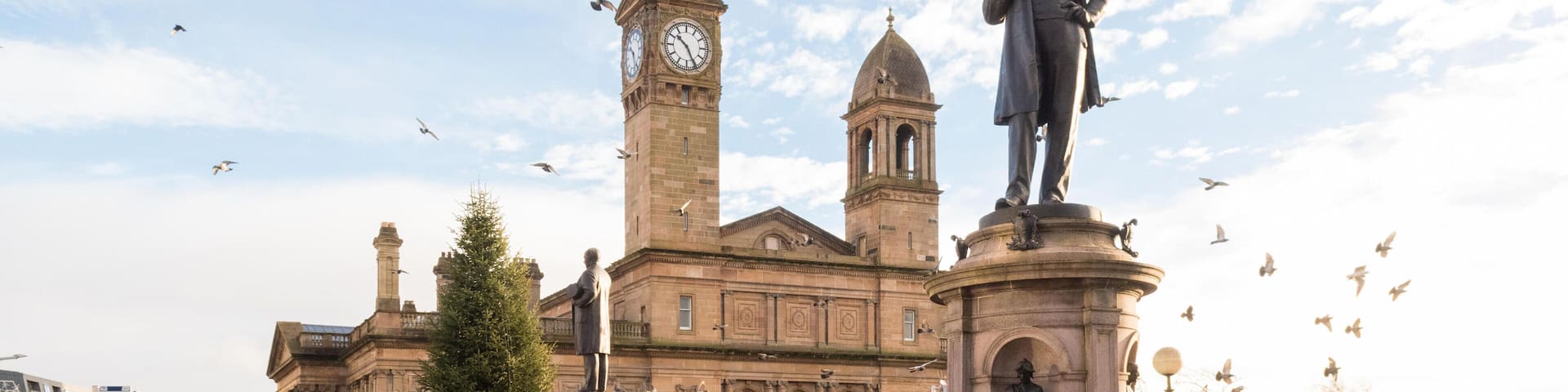 KM7XNX Paisley city centre, town hall and statue of Sir Peter Coates, Paisley, Scotland