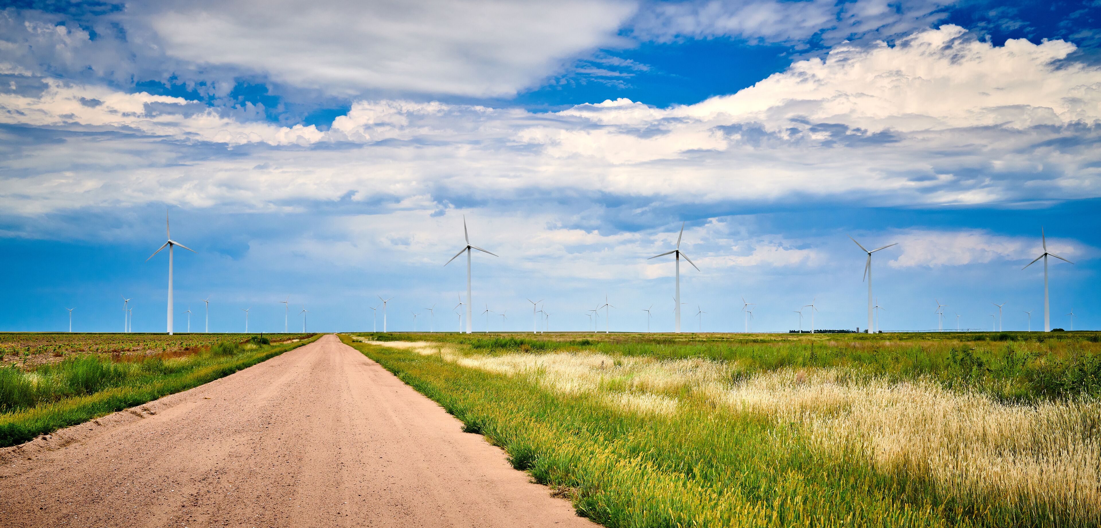 Windmills With Gravel Country Road