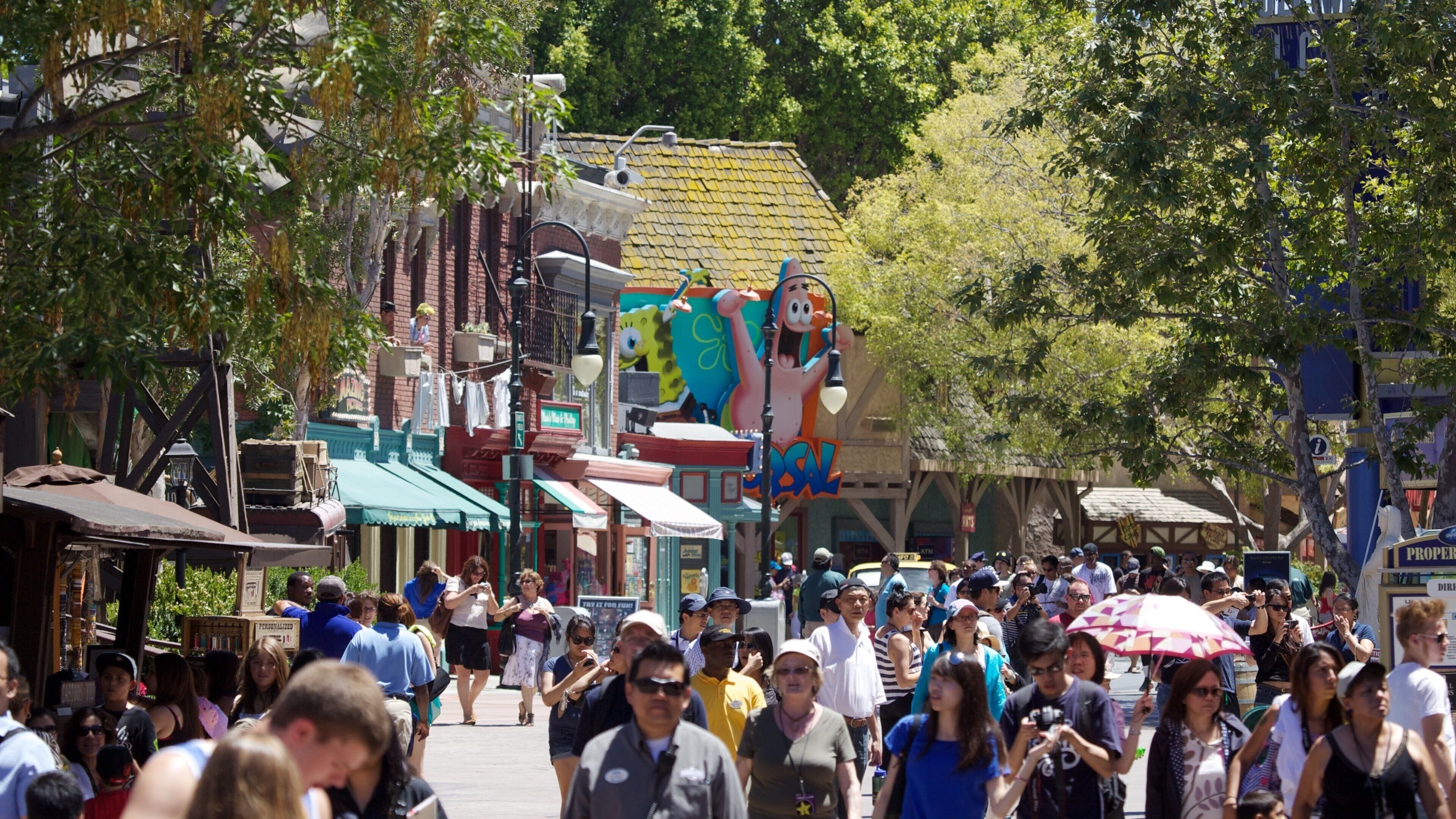 Crowds enjoy a vibrant day at Universal City in California, showcasing attractions and lively street activity