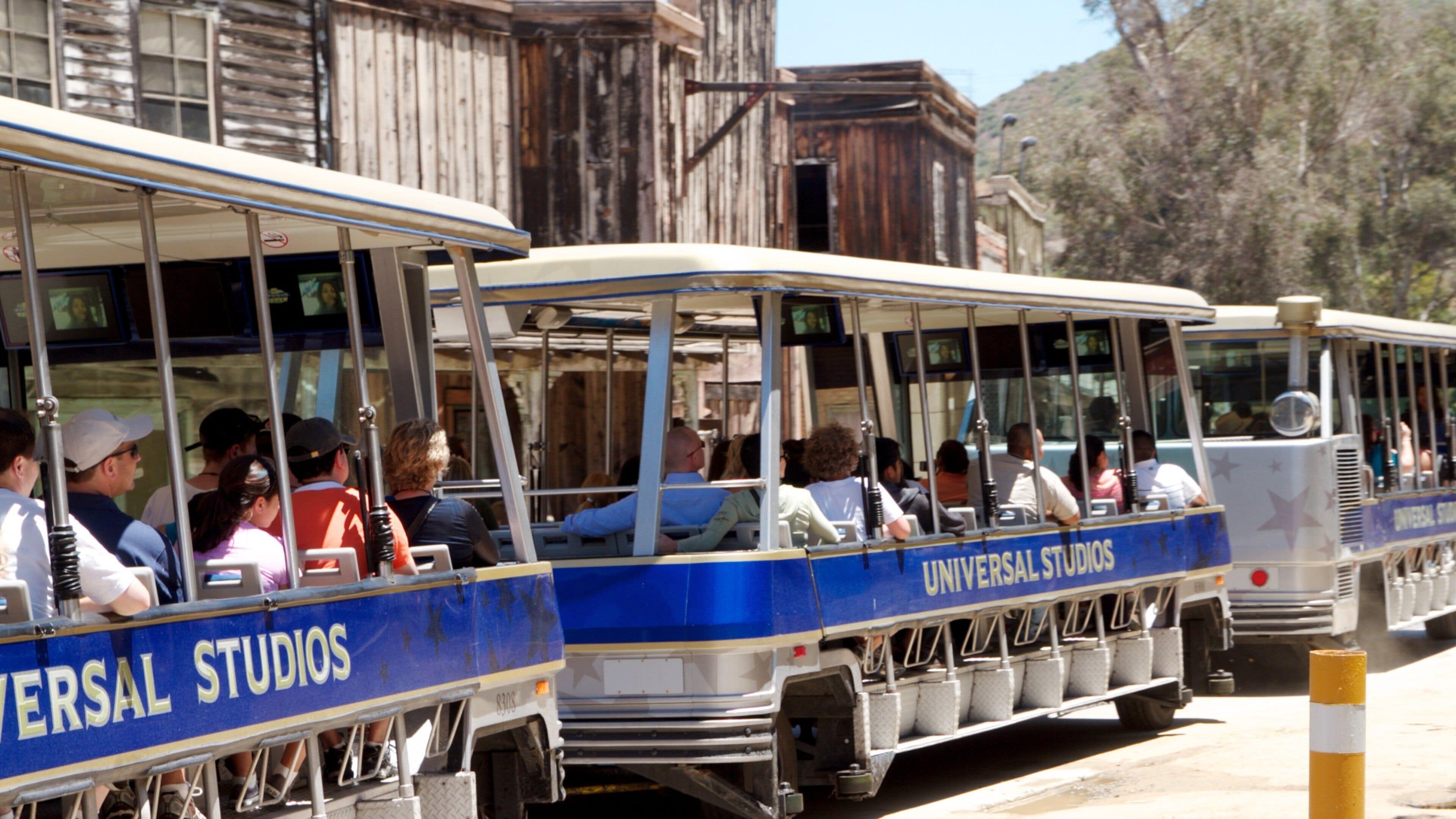 Tourists enjoy a guided trip through Universal City in California with scenic views of the studio backlot