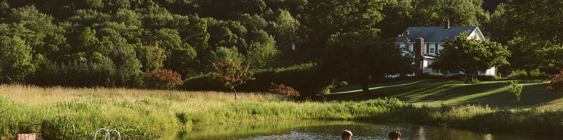 Mother and daughter in rowing boat, on water