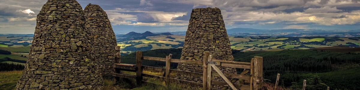 The Three Brethren are 3 large stone cairns, pictured here with the 3 peaks of Eildon Hill in the background. They have been on a hill outside Selkirk since the 16th century when they marked the meeting point of the lands of the Lairds of Yair, Philiphaugh and Selkirk.
