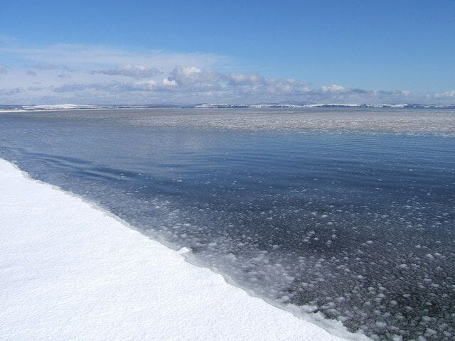 Snow on the shore and lying on the sea at Sandhead. A heavy snow shower fell on the sand when the tide was out. The incoming tide lifted the snow on top of the water. A rare sight for somewhere that gets snow about once every two or three years.