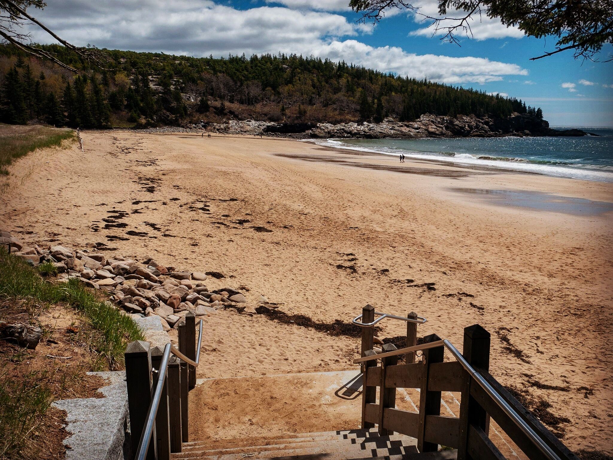 Sand Beach in Acadia National Park.  The water will be cold, even in August, and its usually much busier than this, but it's always beautiful!  Parking is limited so I recommend taking Acadia's free Island Explorer shuttle.