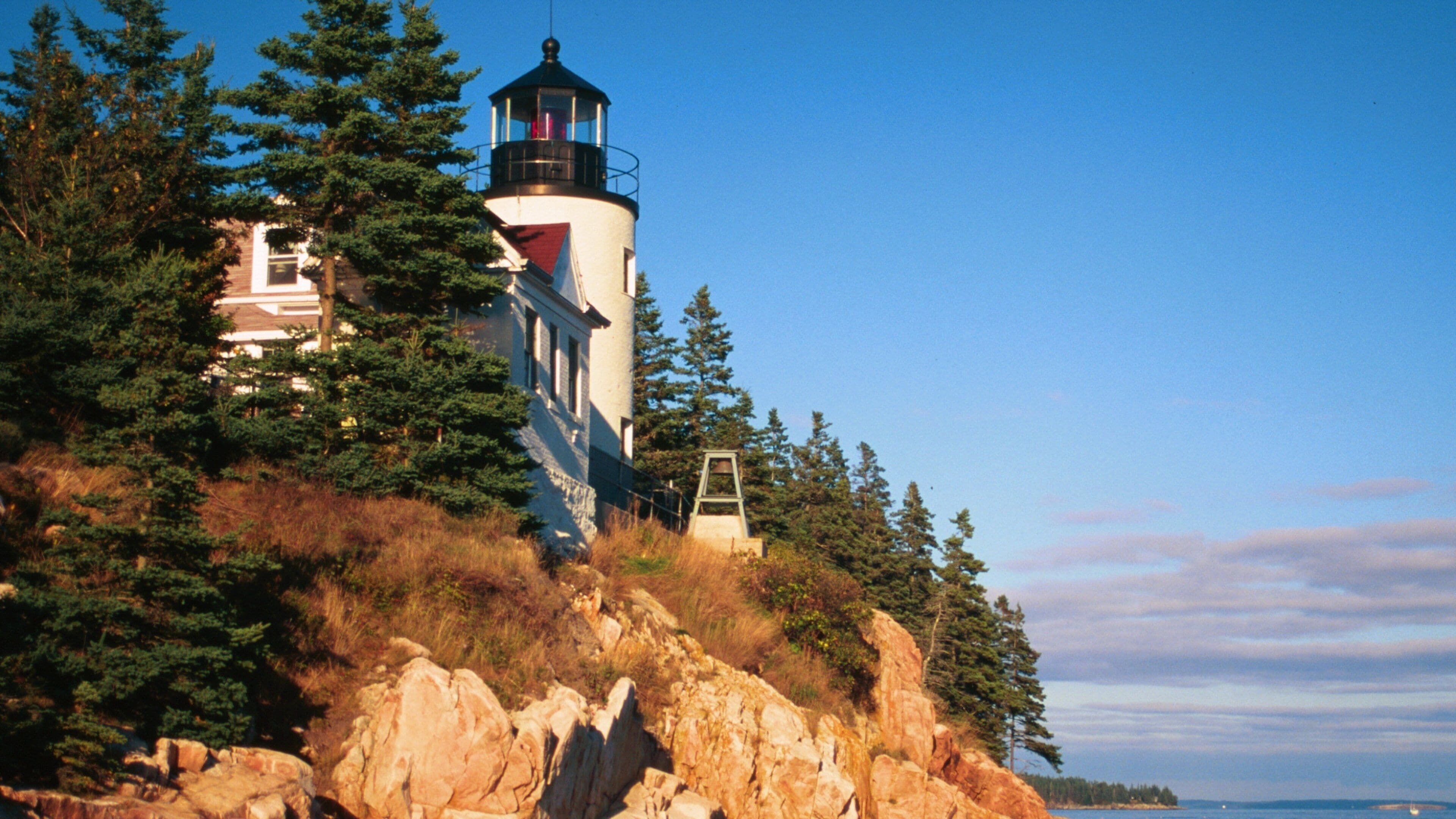 Bar Harbor showing rocky coastline and a lighthouse