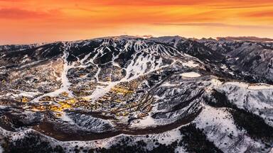 Snowmass Village with sunset and ski slopes