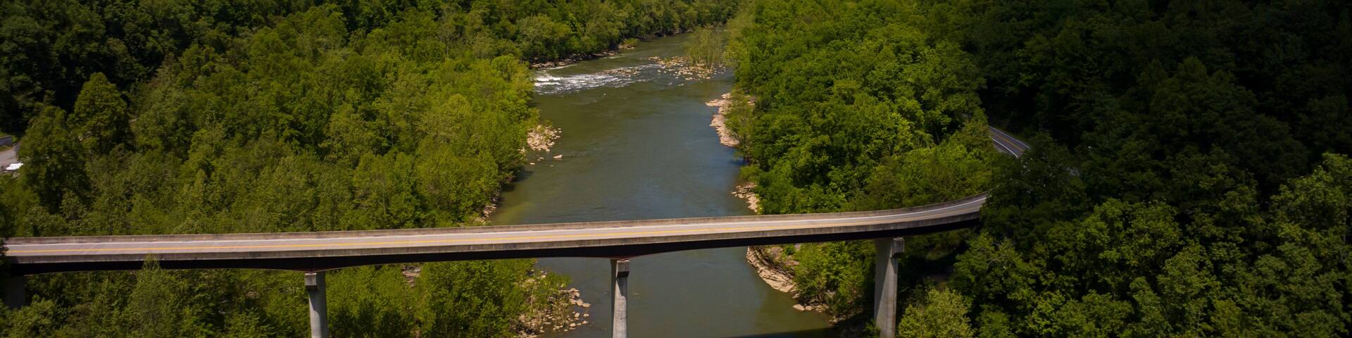 MAY 8, 2023, ANSTED WEST VIRGINIA, USA - Route 16 goes over New River in West Virginia surrounded by green forest in spring