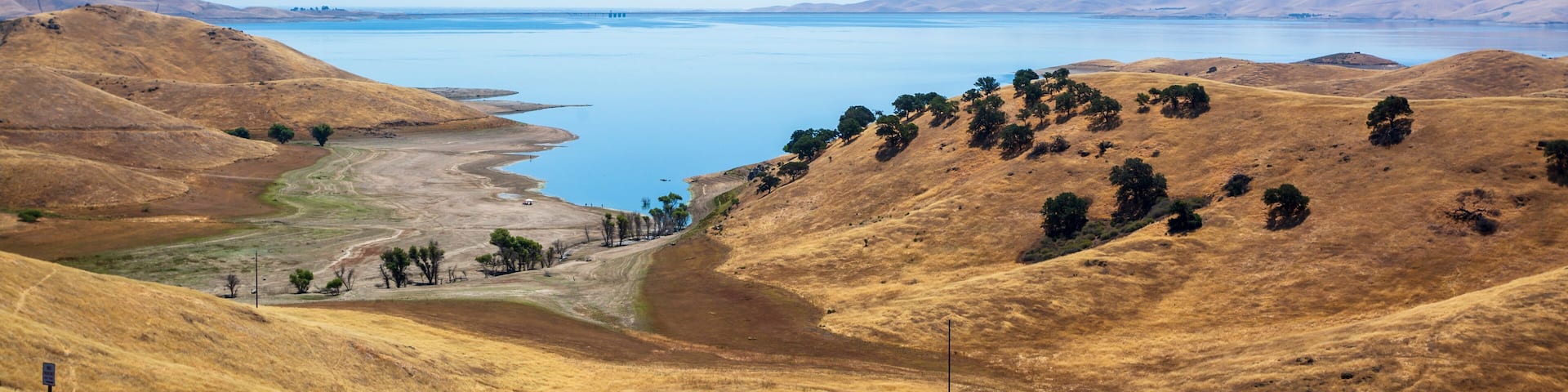 Driving through the golden hills of California; the San Luis Reservoir State Recreation area