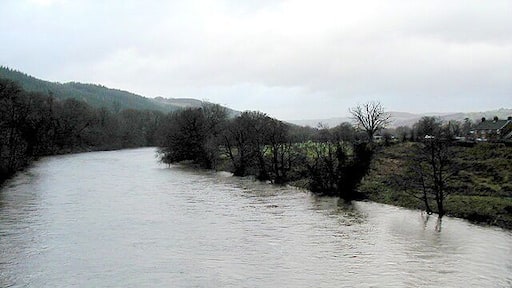 The River Wye in full spate Viewed from the road bridge at Llyswen