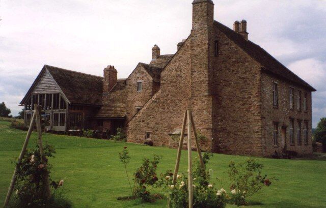 Tredustan Court, Talgarth. A large house with an eye-catching wooden shed behind.
