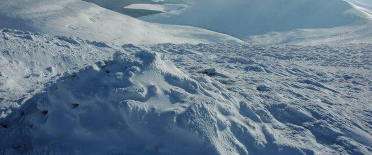 Snow covered cairn, Pen Trumau View to the south-east from a cairn on Pen Trumau down the valley through which Grwyne Fachen flows. On the left are the slopes of Gadair Fawr and on the right is Mynydd Llysiau.