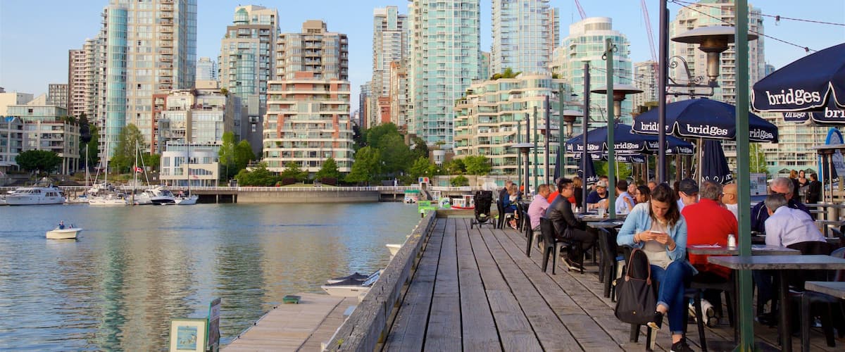 Granville Island which includes outdoor eating, a city and a bay or harbour