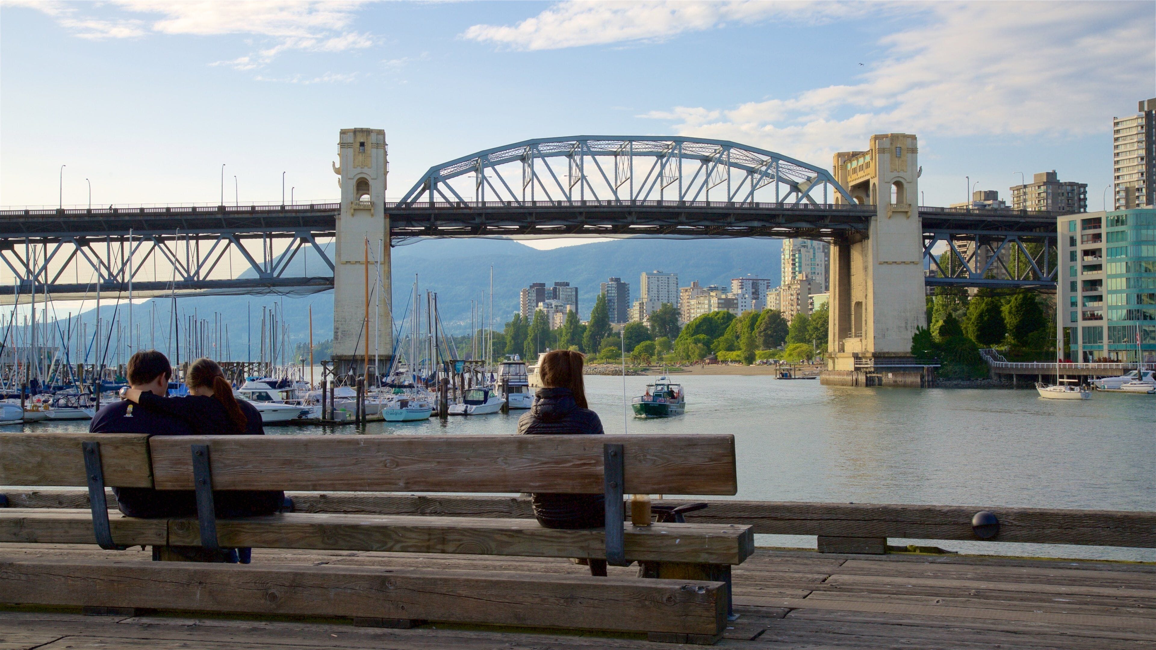 Granville Island which includes a river or creek, a bridge and a bay or harbour