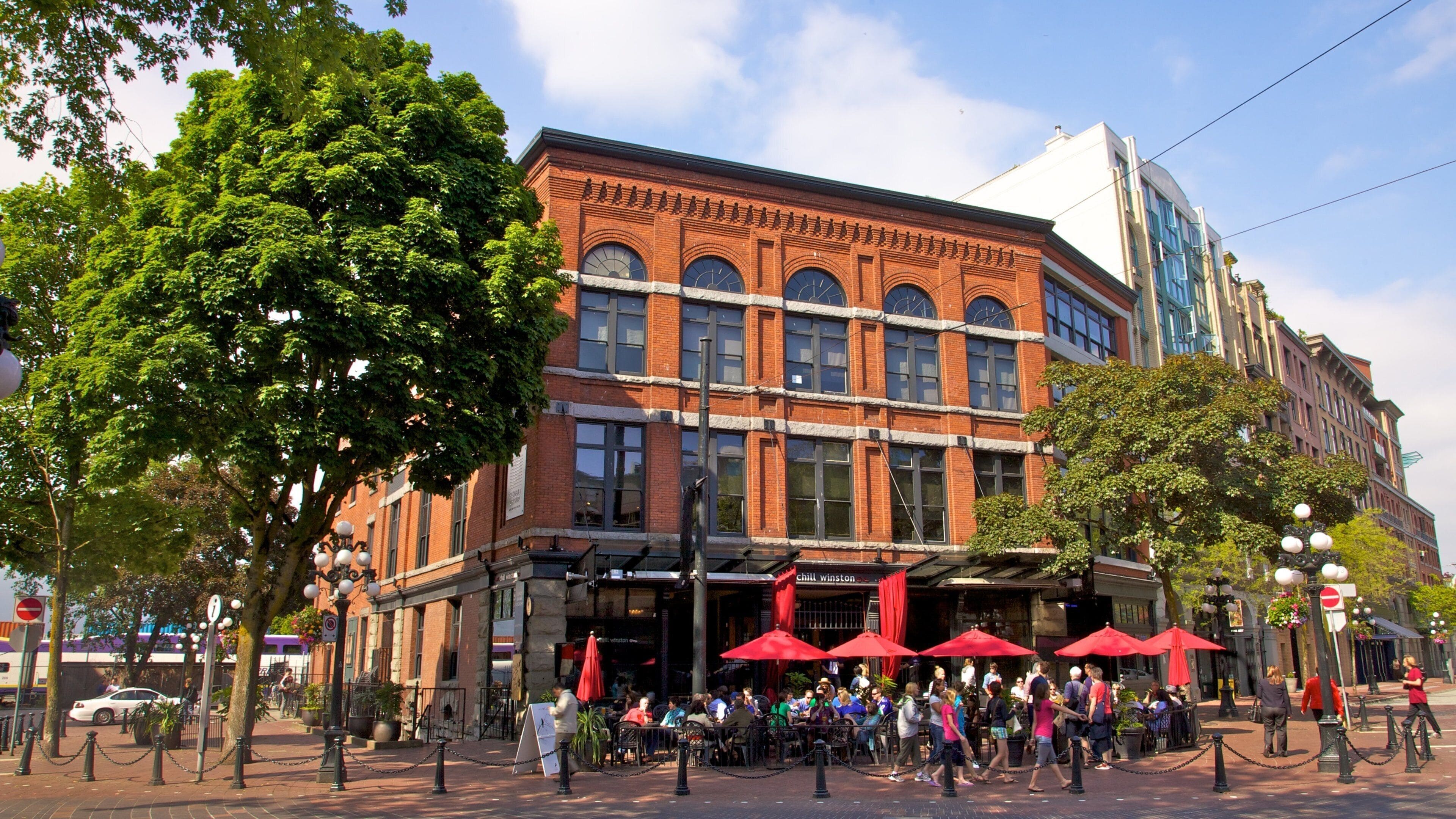 Historic Gastown in Vancouver showcases vibrant cafes and lively street activity on a sunny day