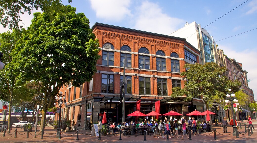 Historic Gastown in Vancouver showcases vibrant cafes and lively street activity on a sunny day