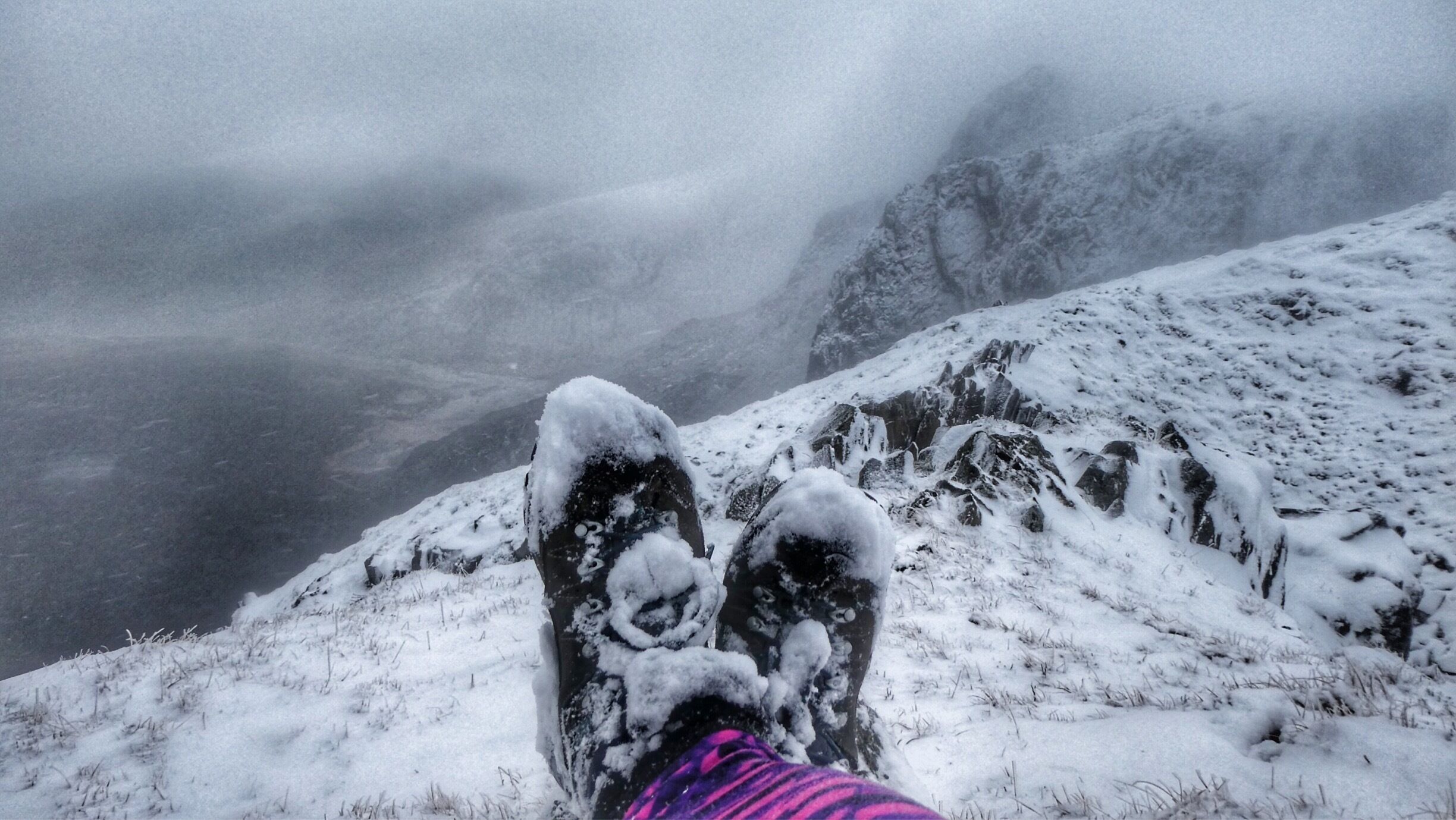 Very snowy boots overlooking Cwm Silyn