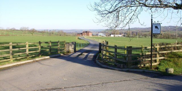 Lower court The sign at the entrance reads- LOWER COURT. BUCHES GWILI. MEIRION A MARGARET. GENUS. LONG LIFE COWS.